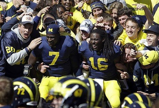 Devin Gardner (7), Denard Robinson (16), Mark Huyge (72), and Nathan Brink (67)