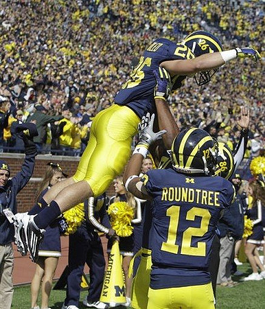 Drew Dileo (26), Kevin Koger (86), and Roy Roundtree (12)
