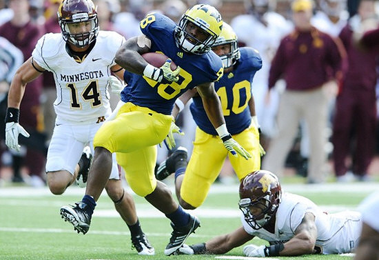 Fitzgerald Toussaint (28) and Jeremy Gallon (10)