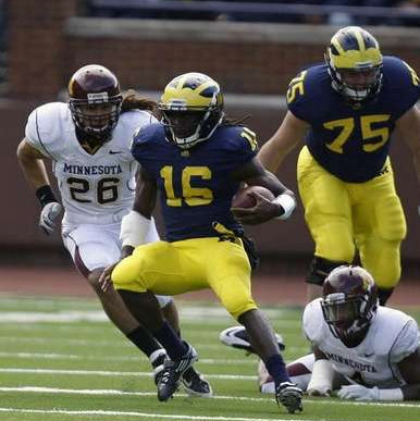 Denard Robinson (16) and Michael Schofield (75)