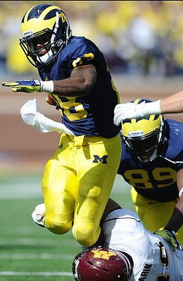 Fitzgerald Toussaint (28) and Brandon Moore (89)