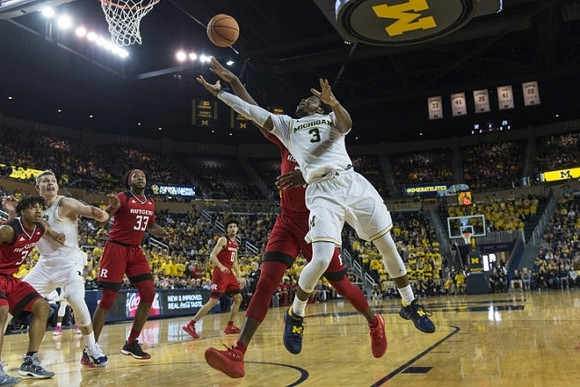 Moritz Wagner (13) and Zavier Simpson (3)