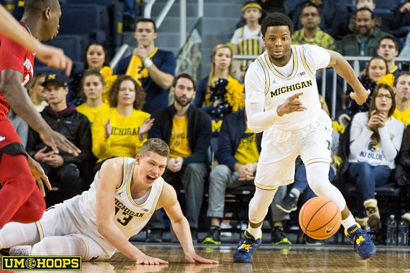 Moritz Wagner (13) and Zavier Simpson (3)