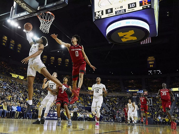 Jordan Poole (2), Duncan Robinson (22), Muhammad-Ali Abdur-Rahkman (12), Jaaron Simmons (5), and Jon Teske (15)