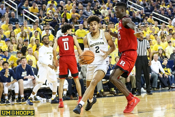 Jordan Poole (2) and Zavier Simpson (3)