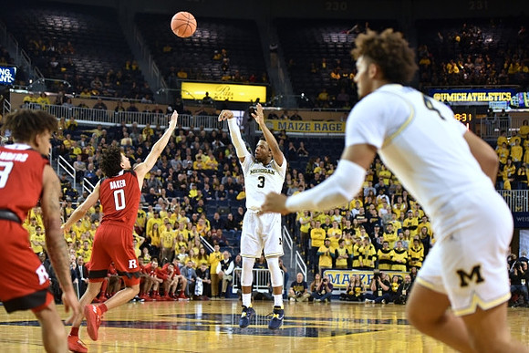 Zavier Simpson (3) and Isaiah Livers (4)
