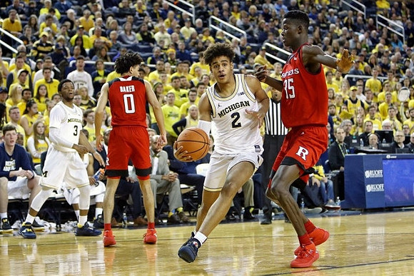 Jordan Poole (2) and Zavier Simpson (3)