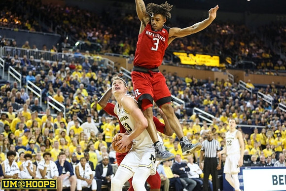 Moritz Wagner (13) and Duncan Robinson (22)