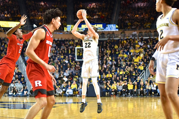 Duncan Robinson (22) and Jordan Poole (2)