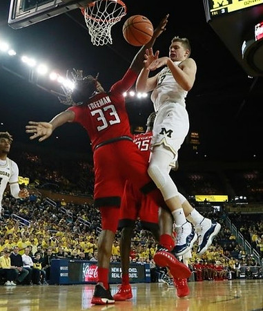 Isaiah Livers (4) and Moritz Wagner (13)