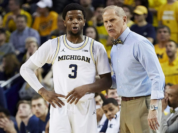 Zavier Simpson (3) and John Beilein