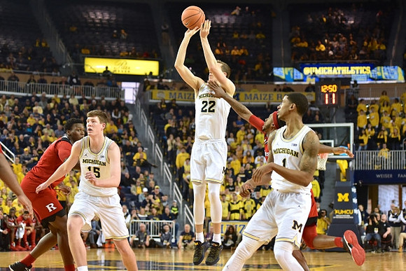 Jon Teske (15), Duncan Robinson (22), and Charles Matthews (1)