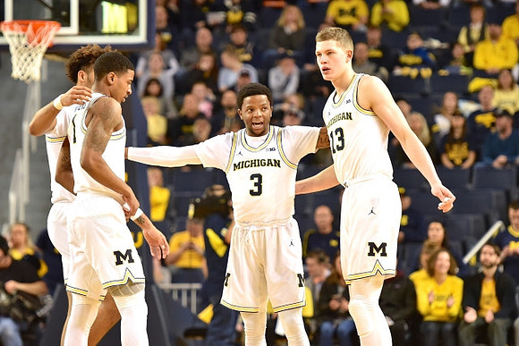 Isaiah Livers (4), Charles Matthews (1), Zavier Simpson (3), and Moritz Wagner (13)