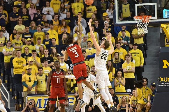 Duncan Robinson (22) and Zavier Simpson (3)
