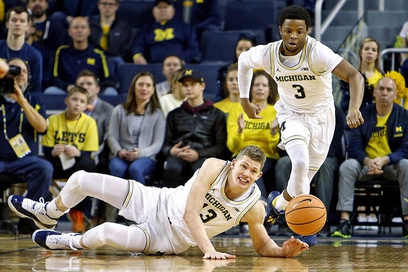 Moritz Wagner (13) and Zavier Simpson (3)