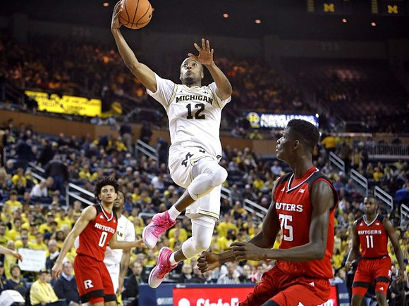 Muhammad-Ali Abdur-Rahkman (12) and Zavier Simpson (3)