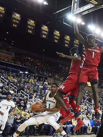 Charles Matthews (1) and Zavier Simpson (3)