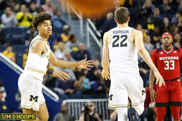 Jordan Poole (2) and Duncan Robinson (22)