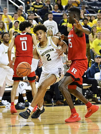 Jordan Poole (2) and Zavier Simpson (3)