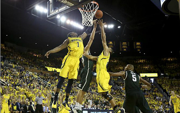 Spike Albrecht (2), Glenn Robinson III (1), and Jon Horford (15)