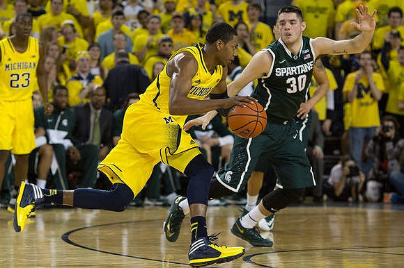 Glenn Robinson III (1) and Caris LeVert (23)
