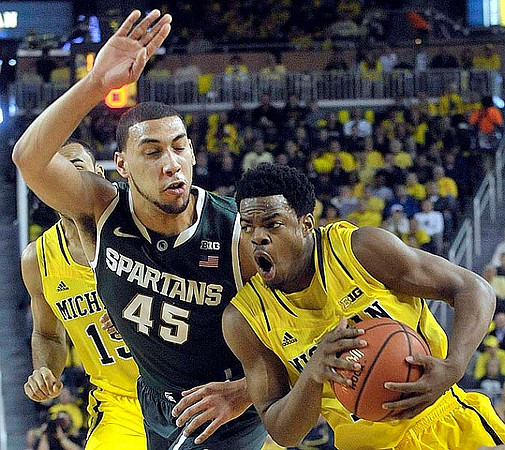 Jon Horford (15) and Derrick Walton Jr. (10)