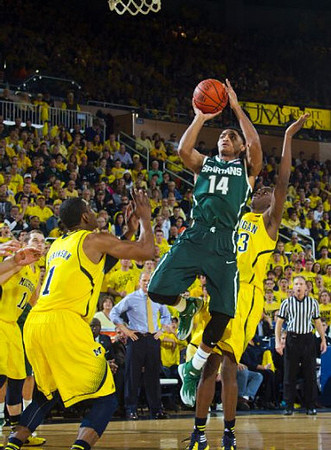 Nik Stauskas (11), Glenn Robinson III (1), and Caris LeVert (23)