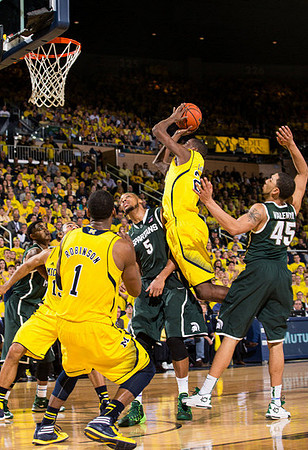 Glenn Robinson III (1) and Caris LeVert (23)