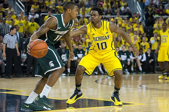 Derrick Walton Jr. (10) and Caris LeVert (23)