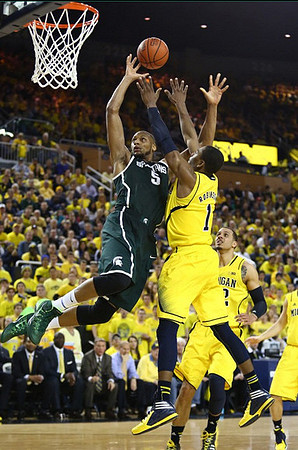 Glenn Robinson III (1) and Jordan Morgan (52)