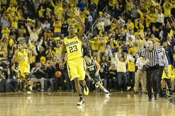 Jon Horford (15) and Caris LeVert (23)