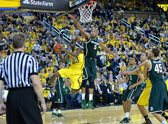 Caris LeVert (23) and Jordan Morgan (52)