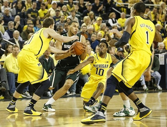 Nik Stauskas (11), Derrick Walton Jr. (10), and Glenn Robinson III (1)