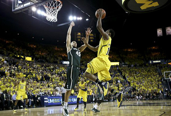 Zak Irvin (21), Glenn Robinson III (1), and Derrick Walton Jr. (10)