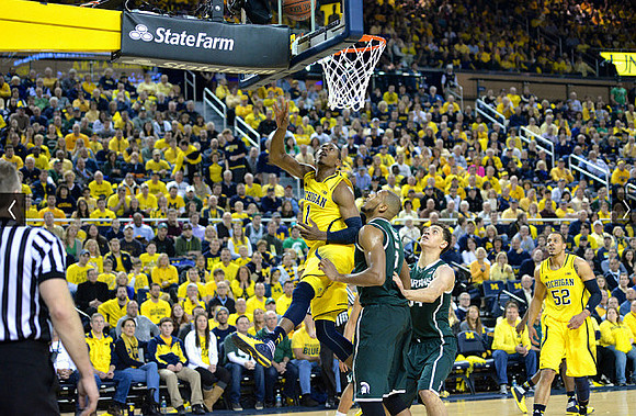 Glenn Robinson III (1) and Jordan Morgan (52)
