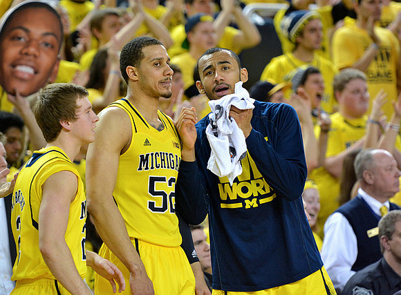 Spike Albrecht (2), Jordan Morgan (52), and Jon Horford (15)