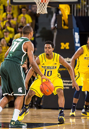 Derrick Walton Jr. (10) and Glenn Robinson III (1)