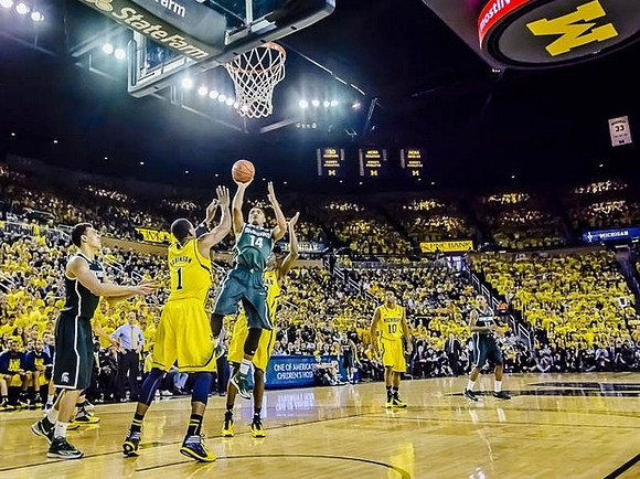 Glenn Robinson III (1), Caris LeVert (23), and Derrick Walton Jr. (10)