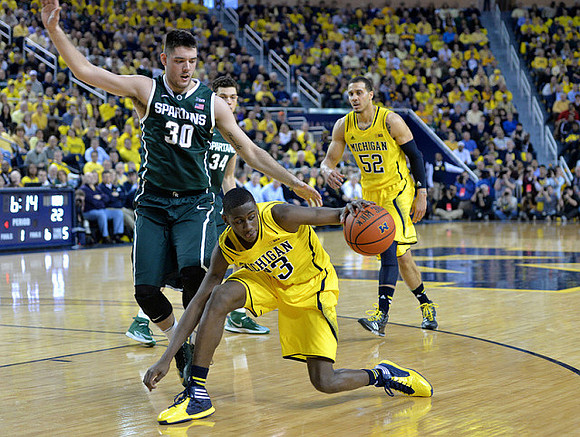 Caris LeVert (23) and Jordan Morgan (52)