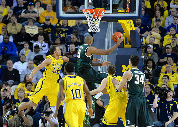 Jordan Morgan (52), Derrick Walton Jr. (10), and Nik Stauskas (11)