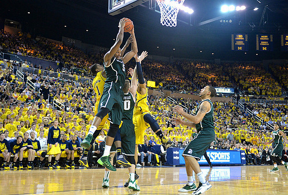 Glenn Robinson III (1) and Jordan Morgan (52)