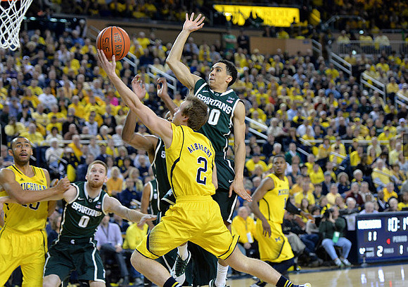 Jon Horford (15), Spike Albrecht (2), and Glenn Robinson III (1)