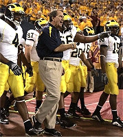 Lloyd Carr, Darnell Hood, Will Johnson, LaMarr Woodley, Michael Hart, Adrian Arrington, and Steve Breaston