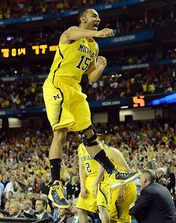 Jon Horford (15), Spike Albrecht (2), and Mitch McGary (4)
