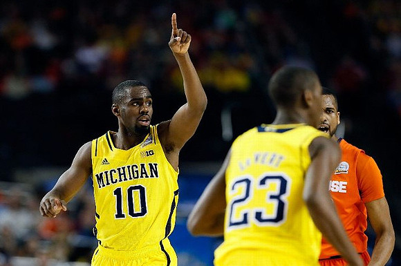 Tim Hardaway Jr. (10) and Caris LeVert (23)