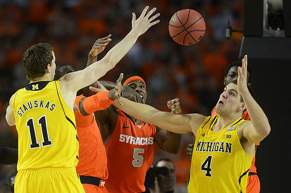 Nik Stauskas (11) and Mitch McGary (4)