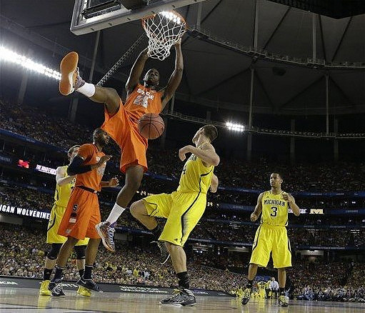 Nik Stauskas (11), Mitch McGary (4), and Trey Burke (3)