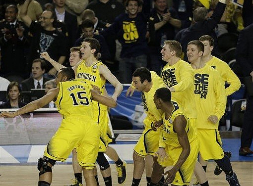 Jon Horford (15), Spike Albrecht (2), Nik Stauskas (11), Josh Bartelstein (20), Glenn Robinson III (1), Blake McLimans (22), Max Bielfeldt (44), and Matt Vogrich (13)