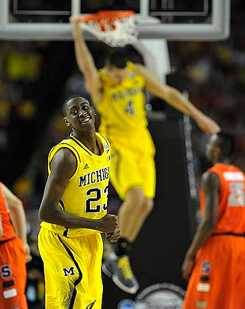 Caris LeVert (23) and Mitch McGary (4)