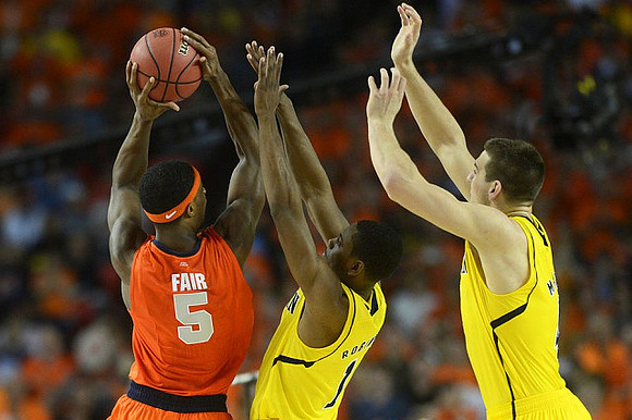 Glenn Robinson III (1) and Mitch McGary (4)
